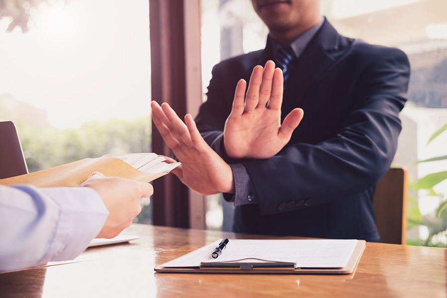 A man rejecting an offer.