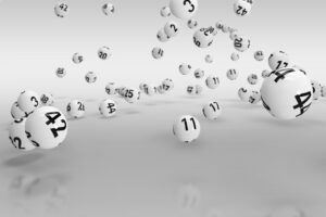 An image showing several white numbered lottery balls.