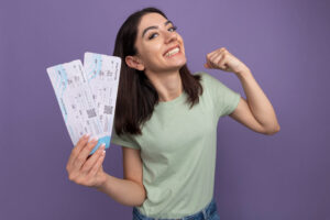 Customer holding tickets after online coupon verification process