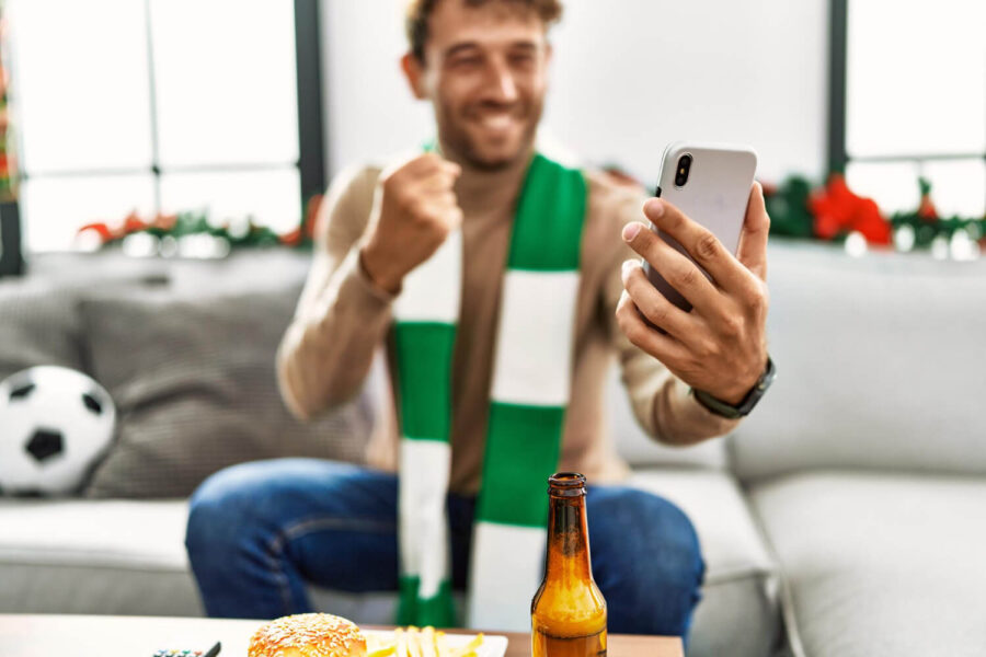 Online sports bettor reacts to win, soon facing betting taxes responsibilities