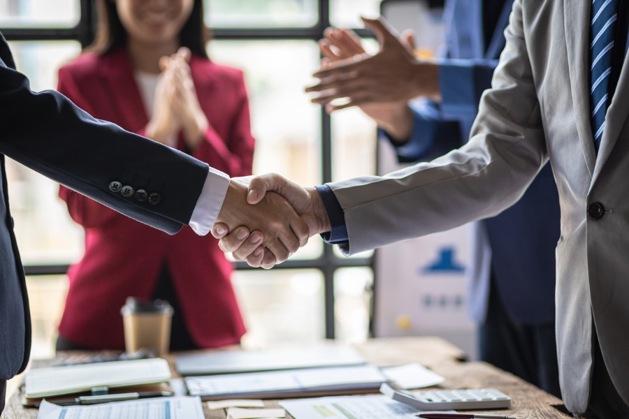 Two men shaking hands.