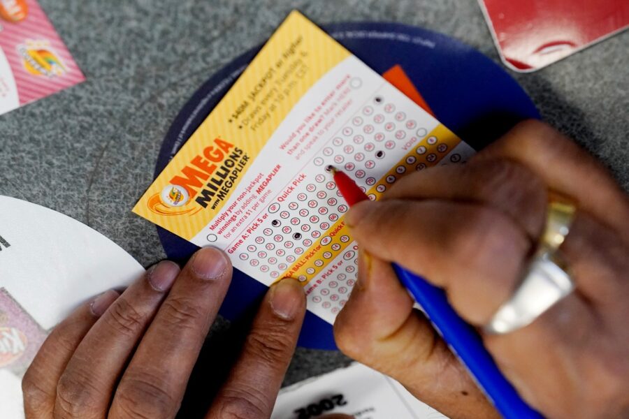 Selecting numbers on a lottery ticket.