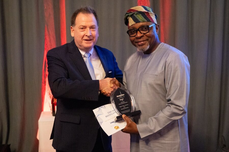 Nigeria’s Bashir Abiola-Are (right), CEO of LSLGA, receives the Regulatory Innovation Award from Brian Krolicki, Vice President of the IAGR.