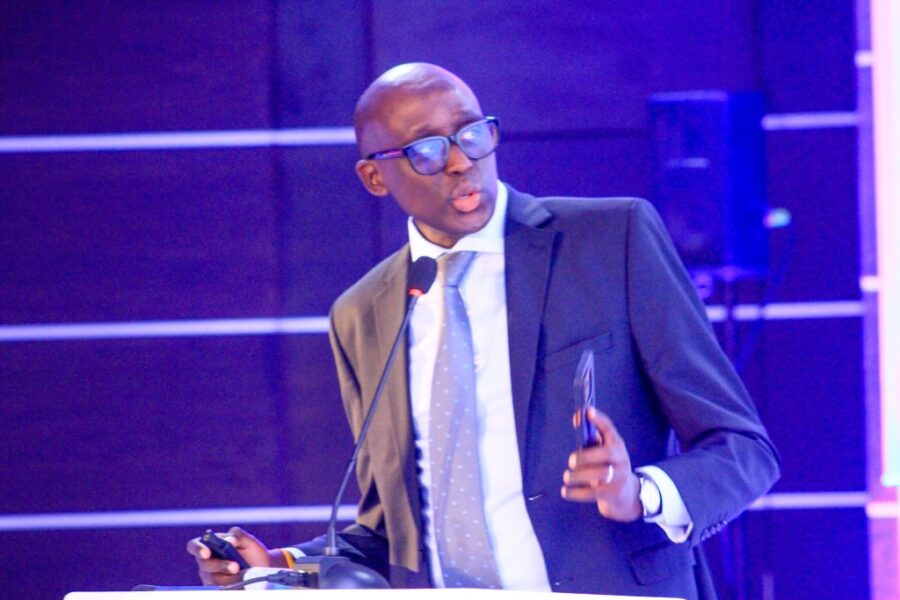 Uganda’s National Lotteries and Gaming Regulatory Board CEO Denis Mudene addresses government leaders, emphasising responsible gaming and collaboration. 