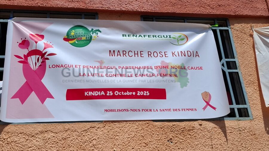 LONAGUI and RENAFERGUI unite in the fight against cancer: the campaign banner at Kindia’s Pink October event highlights their partnership for women’s health