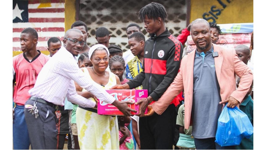 Representatives of the Sis Iye Children Orphanage receive essential supplies from Bettomax, presented by Operations Manager Fallah Braima (right), as part of the company’s monthly community support program in Liberia.