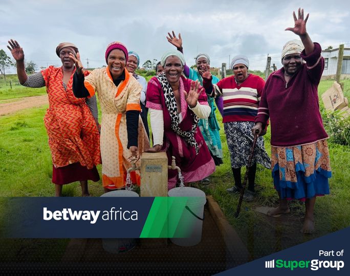 Residents of Matshemhlophe Village in South Africa celebrate access to clean water, made possible by a solar-powered system funded by Betway Cares and the Innovate Africa Foundation.