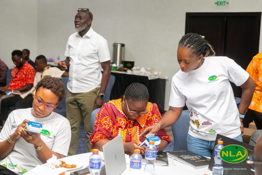 Lottery management and staff participate in a hands-on training session on the new POS system as part of the nationwide rollout initiative.