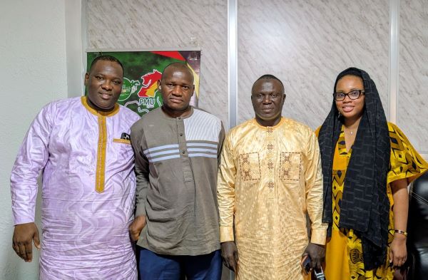 Abdoulaye Touré (second right) with other LONAGUI members following his appointment as Acting Commercial Director.
