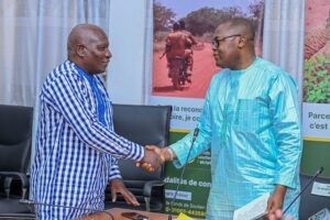 Maxime Compaoré (right) with a senior Ministry of Economy and Finance official during his LONAB board handover ceremony 