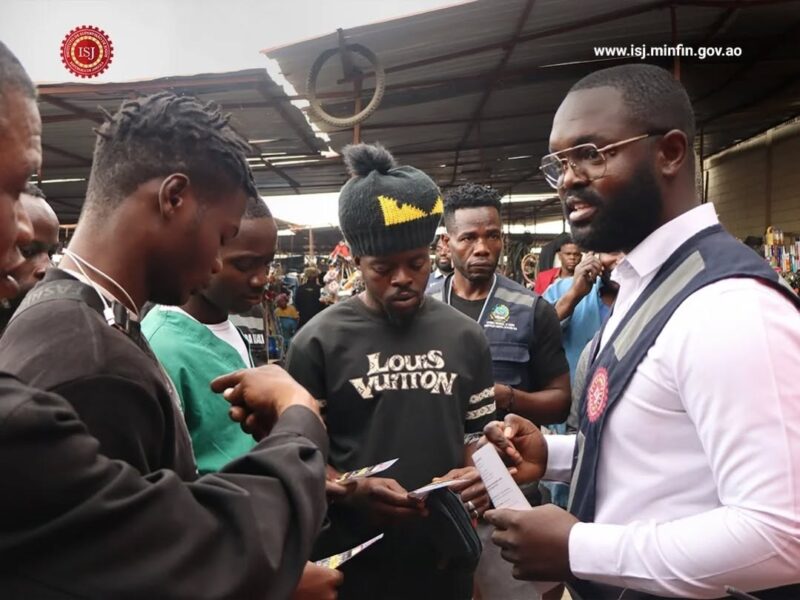  ISJ officials engage traders during an anti-illegal gambling awareness campaign in Angola 