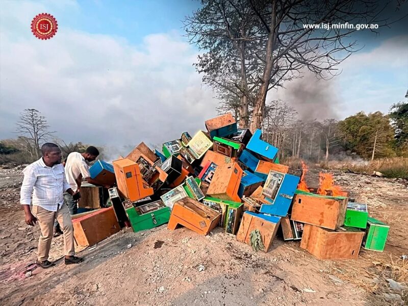 ISJ officials oversee the destruction of seized illegal gaming machines in Cabinda, Angola.