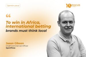 "On the right, a black and white portrait of Jason Gibson, Chief Commercial Officer of SportPesa. To the left, text reads: 'Opinión piece', followed by an orange quotation mark, the headline: 'To win in Africa, international betting brands must think local', and 'Jason Gibson, Chief Commercial Officer SportPesa'.