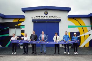 Winfried Engelbrecht-Bresges (fourth from right), Chief Executive Officer, The Hong Kong Jockey Club and Andrew Harding (third from right), Executive Director, Racing, The Hong Kong Jockey Club, officiate at the ribbon cutting ceremony of the refurbished Racing Talent Training Centre stable.