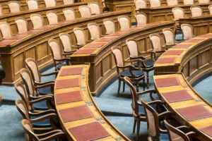 Photo of brown wooden chairs on blue and brown wooden floor