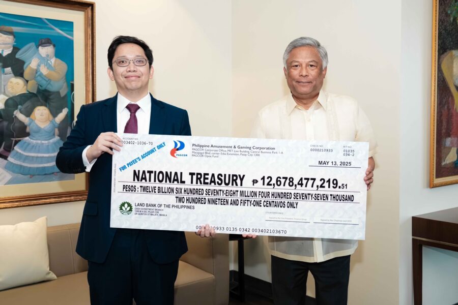 PAGCOR Chairman and CEO Alejandro H. Tengco (right) hands over to Deputy National Treasurer Eduardo Anthony Mariño a facsimile check representing the state gaming firm’s dividend contribution for 2024 during a simple ceremony at the PAGCOR Executive Office in Pasay City on May 14.