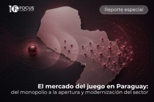 Un gráfico promocional de Focus Gaming News para un «Reporte especial». La imagen presenta un mapa tridimensional de Paraguay en tonos bronce y rojizos sobre un fondo oscuro. A la izquierda del mapa, una esfera metálica proyecta ondas circulares y flechas direccionales, mientras que la parte derecha del territorio está cubierta por una red de nodos interconectados que simbolizan modernización y tecnología. En la parte inferior, el título reza: «El mercado del juego en Paraguay: del monopolio a la apertura y modernización del sector». El logotipo de Focus Gaming News aparece en la esquina superior izquierda.