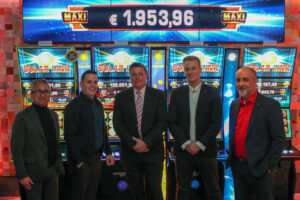 Representatives from Merkur Gaming and Reel Games met to seal the deal.