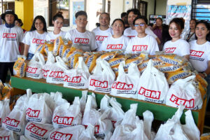 People receiving relief packages from the FBM Foundation.
