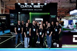 A group of DATA.BET members at the company's stand at SBC Summit Lisbon 2025.