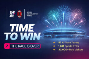 A promotional results graphic for Boomerang, an official regional betting partner of AC Milan. The image features the headlines ‘TIME TO WIN’ and ‘THE RACE IS OVER’ set against a glowing football stadium with teal and purple fireworks. Key performance statistics are displayed: 57 Affiliate Teams, 1,611 Sports FTDs, and over 33,000 Hub Visitors.