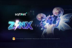 A promotional graphic for Soft2Bet’s ‘ZINX’. The image features a purple dragon character with glowing, electrified wings, wearing a white t-shirt and spinning two translucent, glowing footballs on his fingers. The word ‘ZINX’ is prominently displayed in stylised, neon blue and purple lettering, with a white lightning bolt replacing the ‘I’. The Soft2Bet logo is in the top-left corner, set against a dark stadium background with lightning effects. Regulatory text and an ONJN logo are included at the bottom.