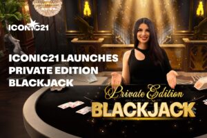 A promotional graphic announcing that ‘ICONIC21 LAUNCHES PRIVATE EDITION BLACKJACK’. The image features a smiling female live casino dealer in an elegant black dress standing behind a curved, black blackjack table with playing cards dealt on the surface.