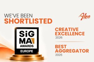 A promotional graphic announcing that Alea has been shortlisted for the SiGMA Europe Awards. Set against a clean, off-white background with a subtle orange wave pattern in the bottom-left corner, the left side features the headline ‘WE’VE BEEN SHORTLISTED’ in grey and orange text above an image of the square black ‘SiGMA AWARDS EUROPE’ trophy resting on a circular gold pedestal.