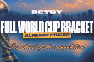 A promotional graphic for Betby featuring the main headline ‘FULL WORLD CUP BRACKET’ in bold white lettering. Below this, the words ‘ALREADY PRICED’ are displayed within a yellow rectangular box, and the tagline ‘Get ahead of the competition’ is written in a stylized yellow script at the bottom.