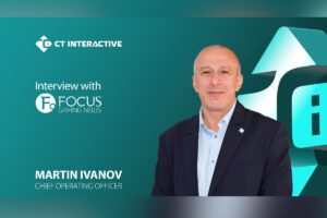 A promotional graphic for an interview with Martin Ivanov, Chief Operating Officer. On the right, a portrait shows Ivanov. On the left, white text reads ‘Interview with’, positioned directly above the Focus Gaming News logo. The CT Interactive logo is located in the top-left corner, and Ivanov’s name and job title are displayed in bold white lettering at the bottom left.