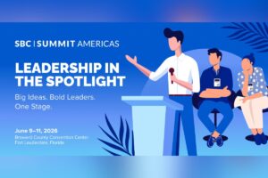 A promotional event graphic for SBC Summit Americas set against a blue gradient background decorated with subtle palm frond illustrations. On the right, a stylized vector illustration depicts a stage setting where a male speaker stands behind a light blue lectern, holding a microphone and gesturing with his hand. Seated behind him are two panel members wearing event lanyards—a man with arms crossed and a woman listening intently. On the left side, the main headline reads ‘LEADERSHIP IN THE SPOTLIGHT’ in bold white text, followed by the subheader ‘Big Ideas. Bold Leaders. One Stage.’ The SBC Summit Americas logo is at the top left, and the event details are displayed at the bottom left: ‘June 9–11, 2026, Broward County Convention Center, Fort Lauderdale, Florida’.