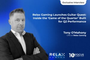 A promotional graphic for an ‘Exclusive Interview’ featuring Tony O’Mahony, CPO at Relax Gaming. The design includes a black-and-white portrait of O’Mahony on the left. The headline reads: ‘Relax Gaming Launches Guitar Quest: Inside the ‘Game of the Quarter’ Built for Q2 Performance’. The Relax Gaming and Focus Gaming News logos are displayed at the bottom right.
