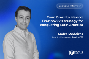 A promotional interview graphic. On the left side, a portrait features Andre Medeiros, Country Manager at Brazino777. In the upper right, a translucent white pill-shaped outline contains the text ‘Exclusive Interview’. Below this, the main headline is written in bold white letters: ‘From Brazil to Mexico: Brazino777's strategy for conquering Latin America’. Medeiros’ name and job title are printed in white below the headline, and the Focus Gaming News logo is positioned in the bottom-right corner.