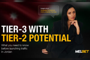 A marketing graphic set against a dark background featuring a blurred flag of Jordan. On the right, a professional portrait of Anastasia Shcherbyna, CMO of Melbet Partners, resting her chin on her hand. A speech bubble above her head reads: 'Insights from Anastasia Shcherbyna, CMO of Melbet Partners'. The main headline on the left in large yellow and white text reads: 'TIER-3 WITH TIER-2 POTENTIAL'. Below this, smaller white text reads: 'What you need to know before launching traffic in Jordan'. The Melbet logo is in the bottom right corner.