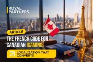 A graphic featuring the Royal Partners logo in the top left corner. In the centre, text reads: 'ARTICLE', followed by the headline: 'THE FRENCH CODE FOR CANADIAN IGAMING: LOCALISATION THAT CONVERTS'. The background shows a desk next to a window overlooking a city skyline, featuring a small Canadian flag, a miniature gold Eiffel Tower figurine, a fountain pen, and a closed notebook.