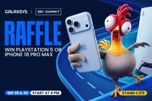 A promotional raffle graphic for SBC Summit. In the top-left corner, the ‘GALAXSYS’ logo is separated by a white vertical bar from the boxed ‘SBC | SUMMIT’ logo. Beneath, the word ‘RAFFLE’ is written in large, bright blue condensed capital letters above white text reading ‘WIN PLAYSTATION 5 OR IPHONE 18 PRO MAX’. On the right side, an animated cartoon rooster with wide, bulging eyes and a red comb stands excitedly, holding up a light blue iPhone in one wing while a PlayStation 5 console and DualSense controller appear behind it on the far right. At the bottom, three rounded badges display event information: ‘SEP 29 & 30’ in blue, ‘START AT 4 PM’ in white, and ‘STAND C219’ in yellow.